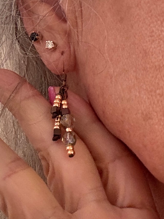 Handmade beaded drop earrings with copper, crystal, and cube beads worn on model — boho dangle earrings by MJ Skivers Designs.