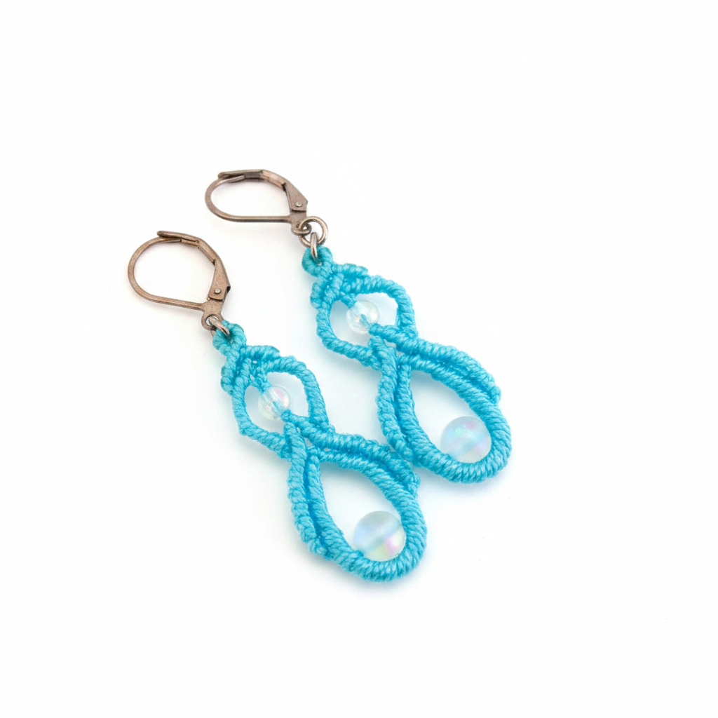 Handmade turquoise macrame double drop earrings with iridescent white mermaid glass beads and silver-tone lever-back closures, displayed on a clean white background.